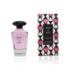 Flacon de parfum JOUR ET NUIT pour femme, rose transparent avec capuchon noir, emballage géométrique rose et noir.