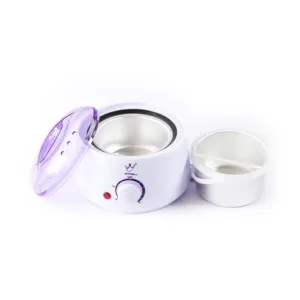 Un chauffe-cire électrique avec un couvercle violet transparent et un récipient en métal amovible.