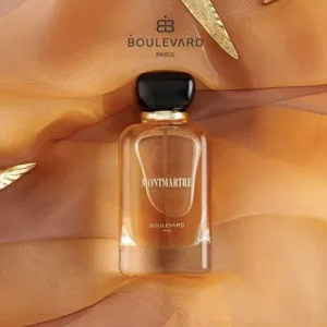 Flacon de parfum ‘Montmartre’ de Boulevard Paris sur fond doré avec feuilles.