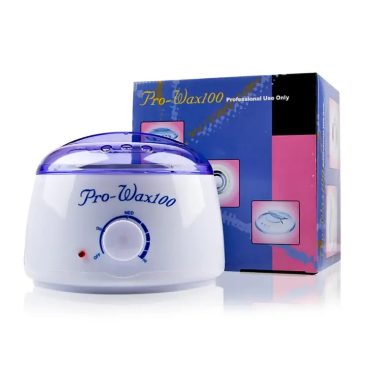 Chauffe-cire Pro-Wax100 avec couvercle violet transparent et boîte d'emballage colorée. Utilisé pour chauffer la cire pour l'épilation.