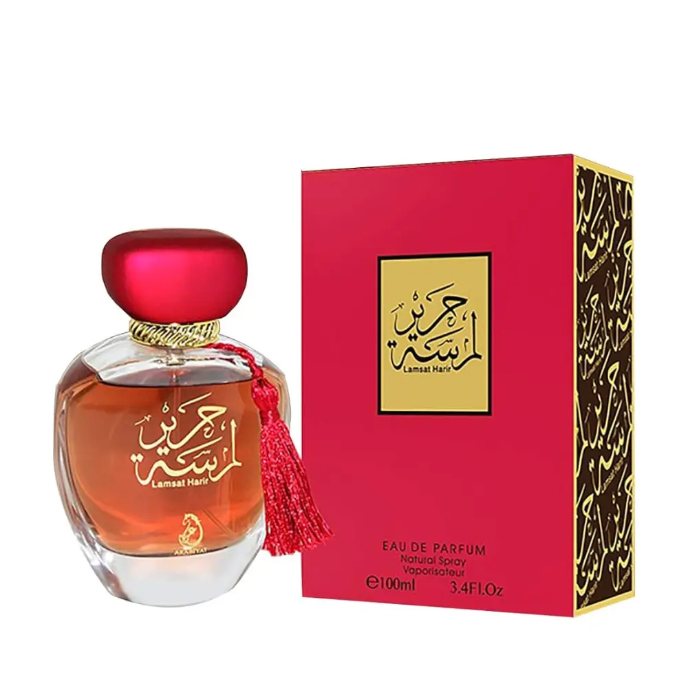 Flacon de parfum Lamsat Harir pour femme avec emballage rouge et noir, évoquant luxe et raffinement.