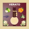 VERATO perfume bottle with gold charm, surrounded by fruits and flowers, on a brown gradient background.”